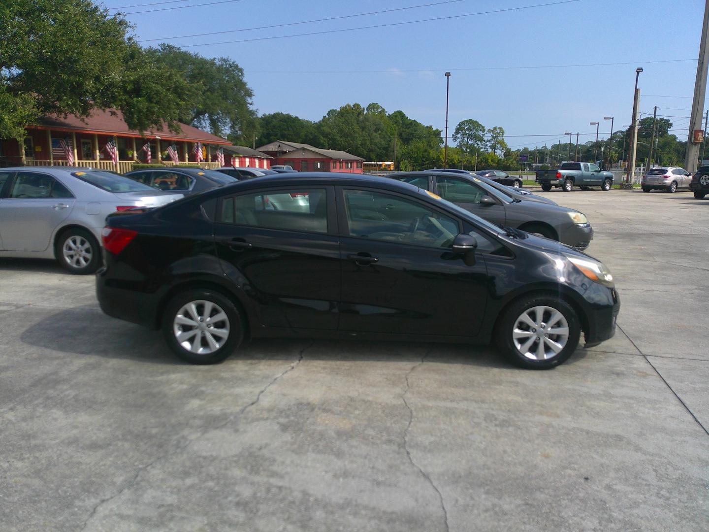 2013 BLACK KIA RIO EX; SX (KNADN4A3XD6) , located at 1200 Cassat Avenue, Jacksonville, FL, 32205, (904) 695-1885, 30.302404, -81.731033 - Photo#4